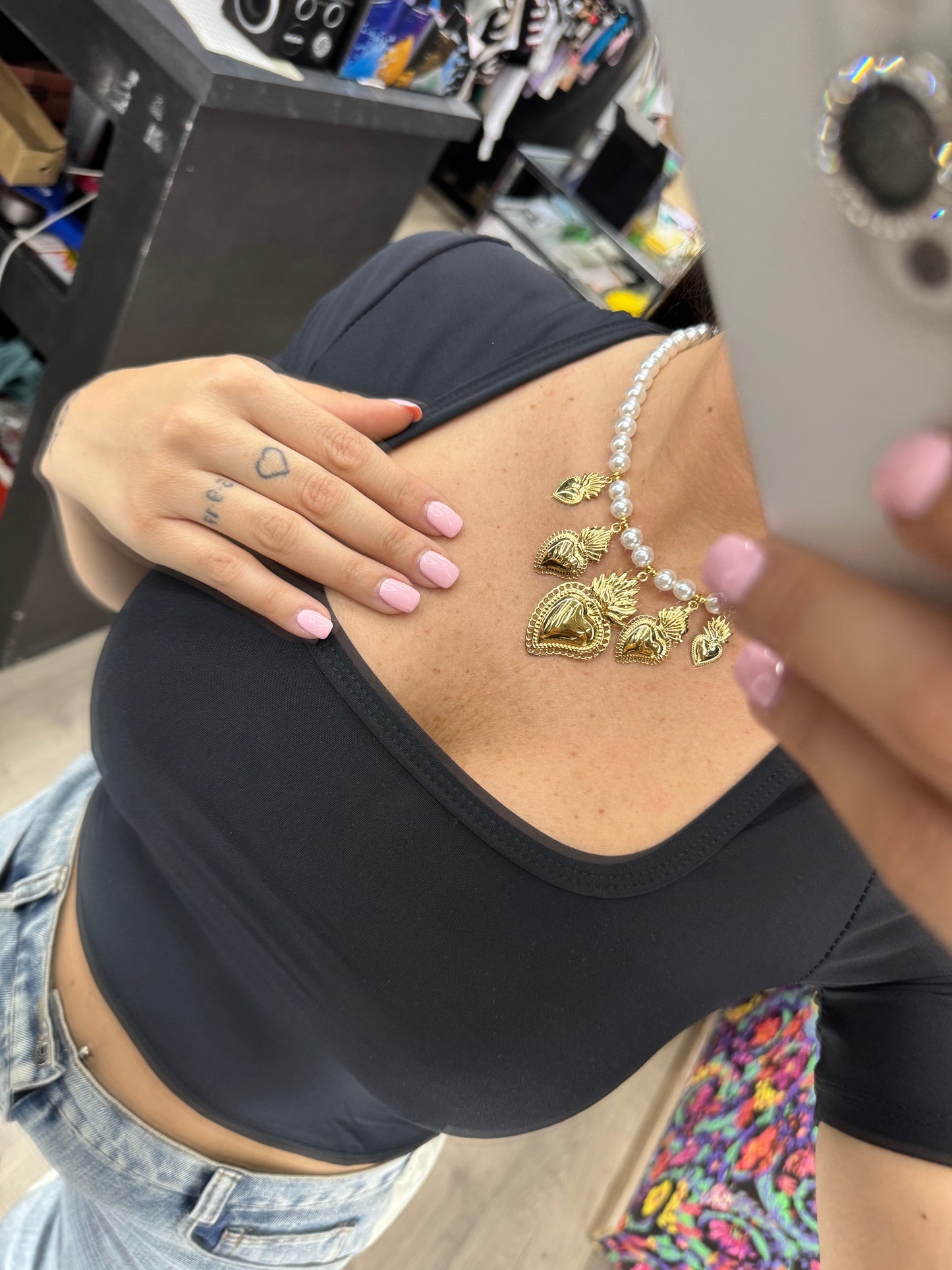 Collana perle con cuore sacro
